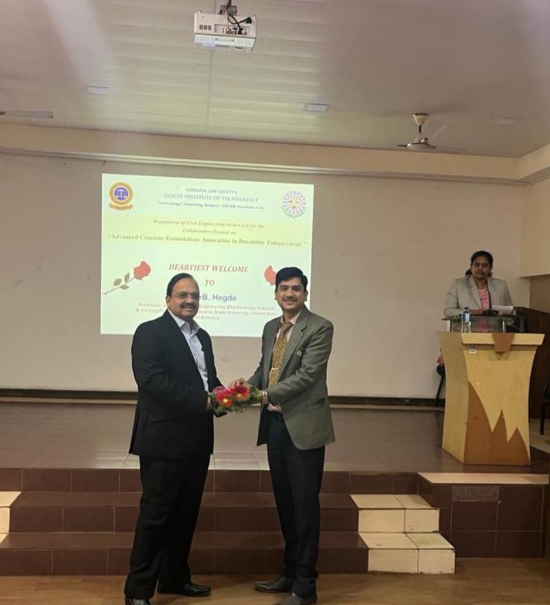 Dr Hegde being welcomed with a bouquet at Gogte Institute of Technology