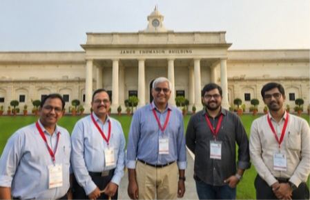 Dr Hegde with faculty members in front of the James Thomason Building, IIT Roorkee