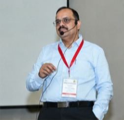 Dr Hegde presenting with a headset microphone at IIT Roorkee